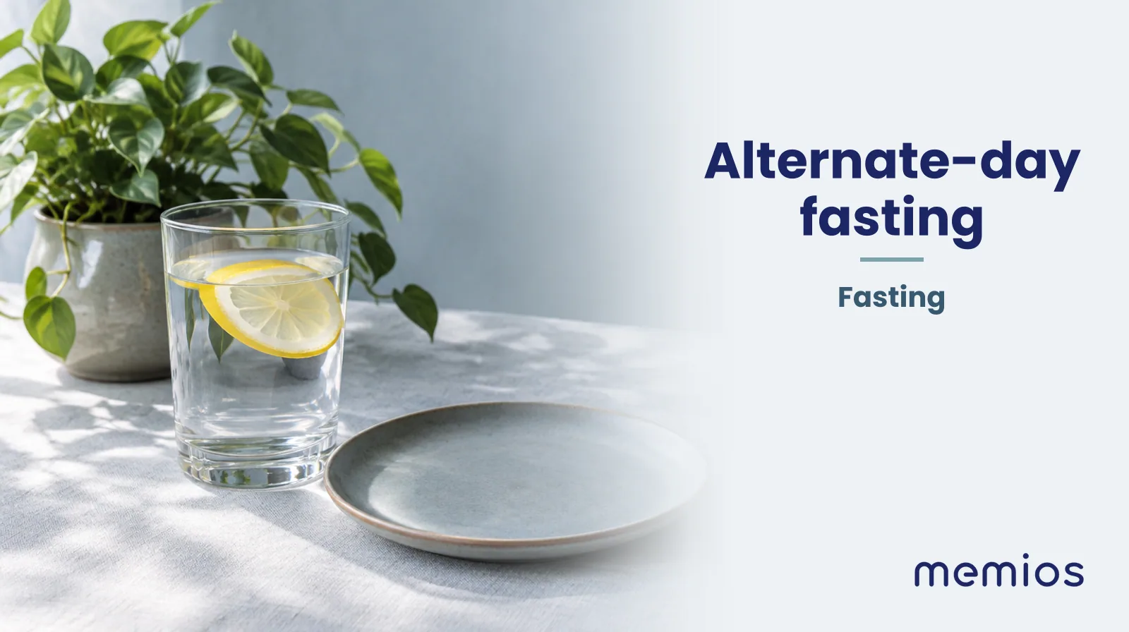 Photograph for Alternate-day fasting: a calm table with an empty plate and a glass of water in morning light.