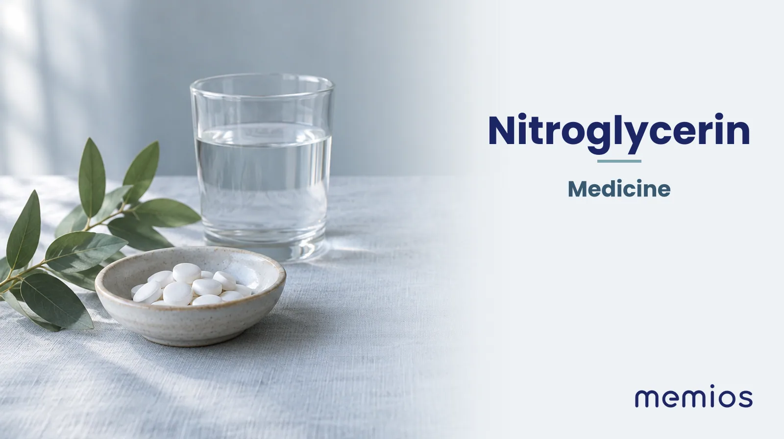 Photograph for Nitroglycerin: plain unmarked tablets in a dish beside a glass of water on pale linen.